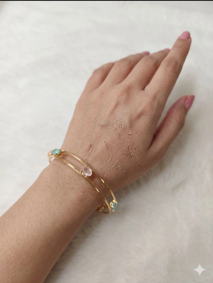 Modern gold-tone bangles.